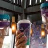 Reusable Java Republic cups being held in the air