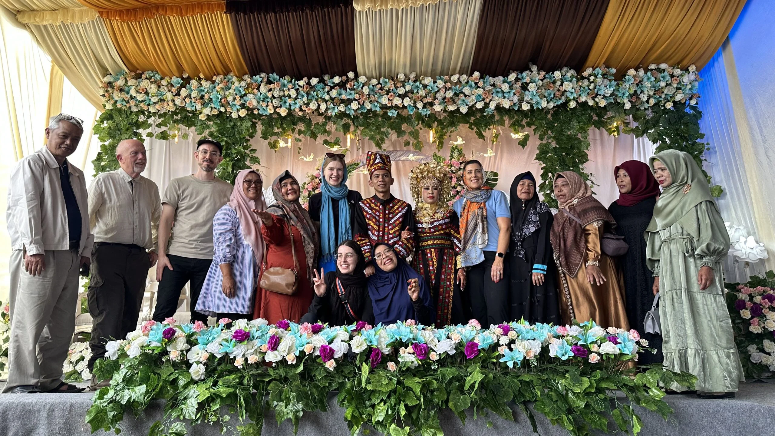 group of people pictured at a traditional Sumatran wedding