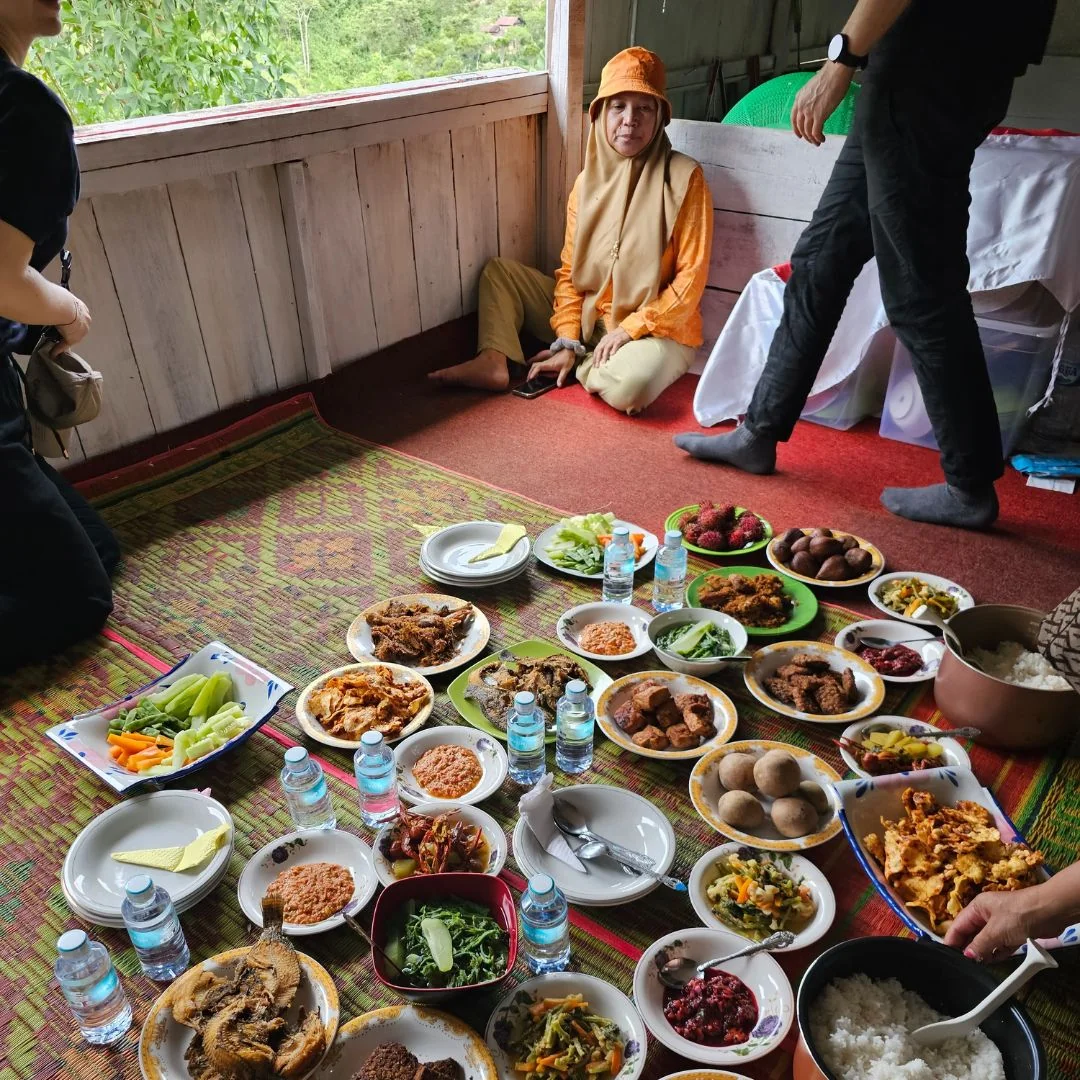 bowls of food on a carpet on the ground