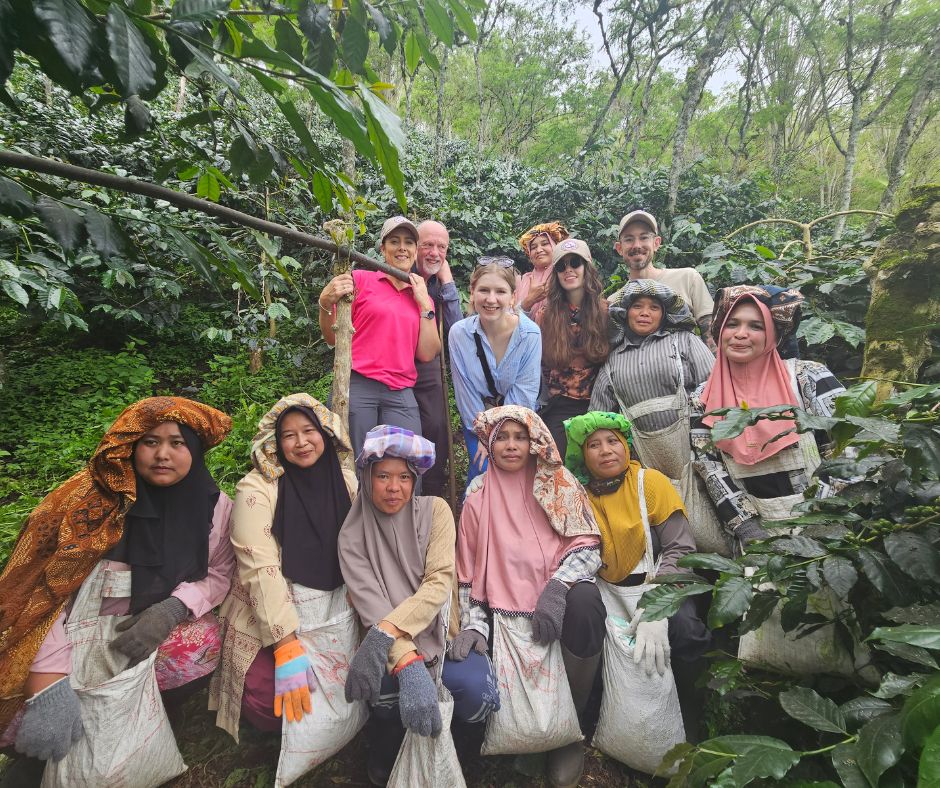 group of people in the jungle smiling