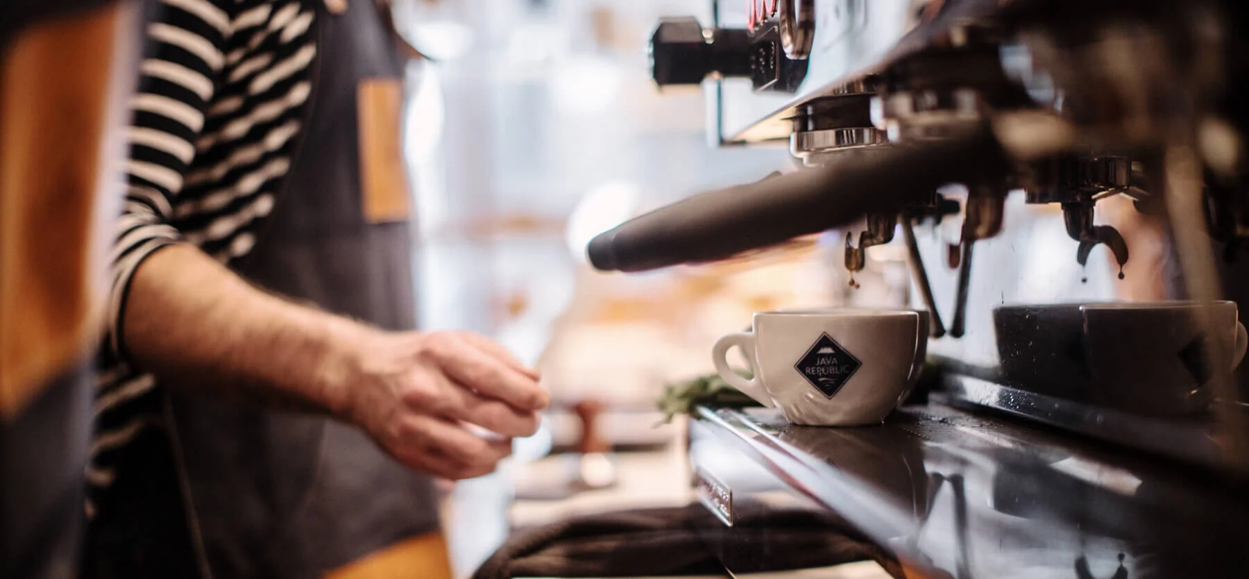 Espresso being pulled by a barista at a coffee shop